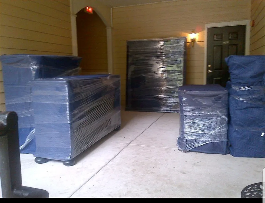 Furniture padded with moving blankets and wrapped before loading